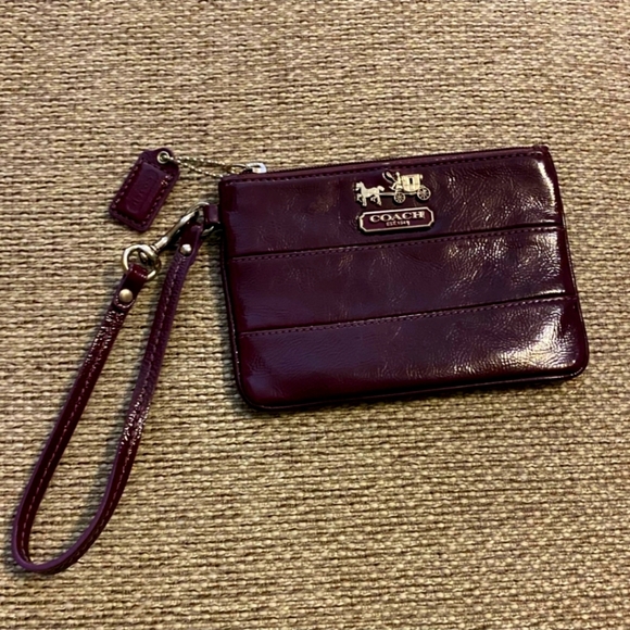 Coach Handbags - Beautiful burgundy patent leather Coach wristlet 6“ x 4“, no callouts